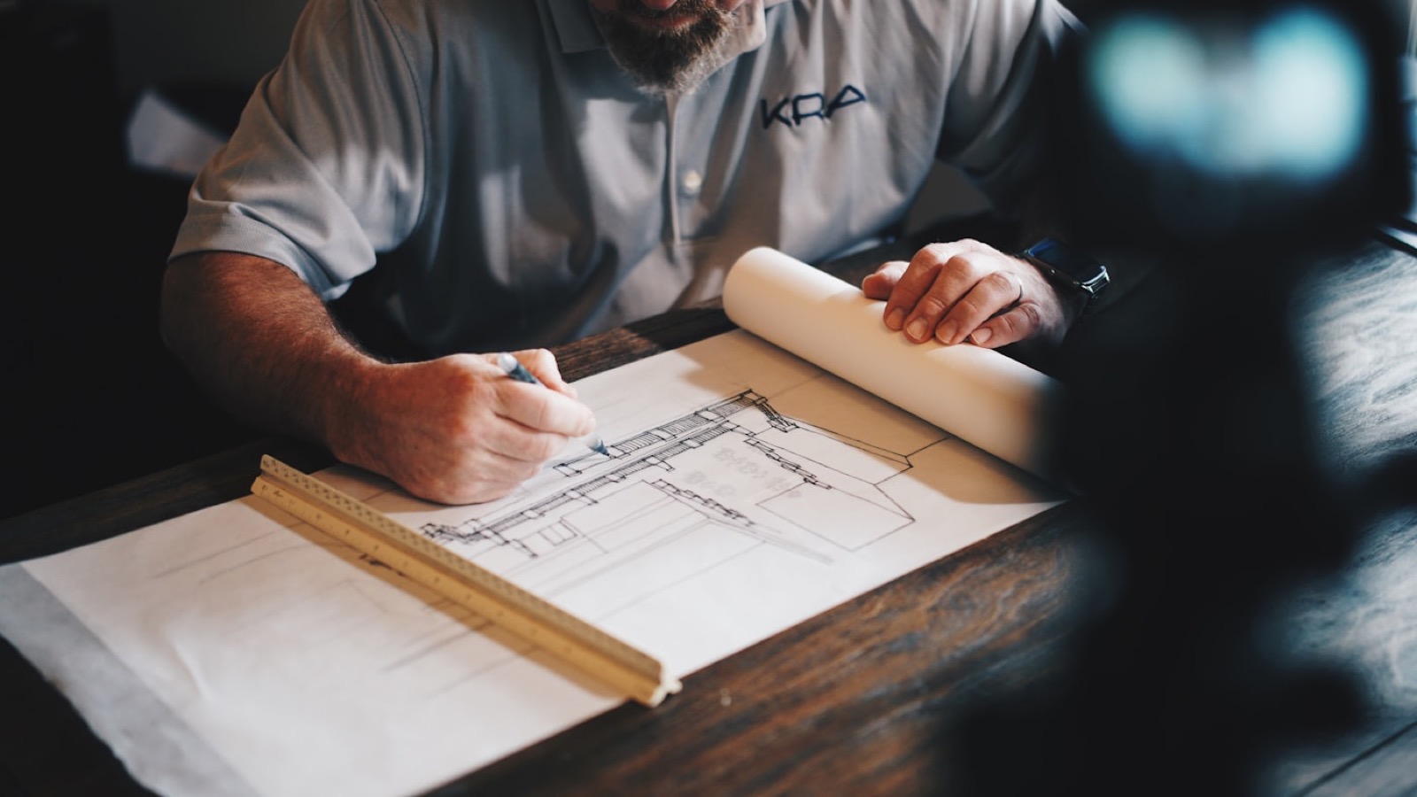 A consultation in a customer's home, reviewing samples on the kitchen island.